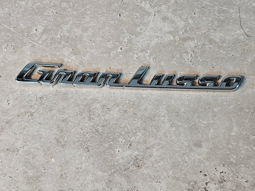 MASERATI LH GRANLUSSO LATERAL EMBLEM 670102611
