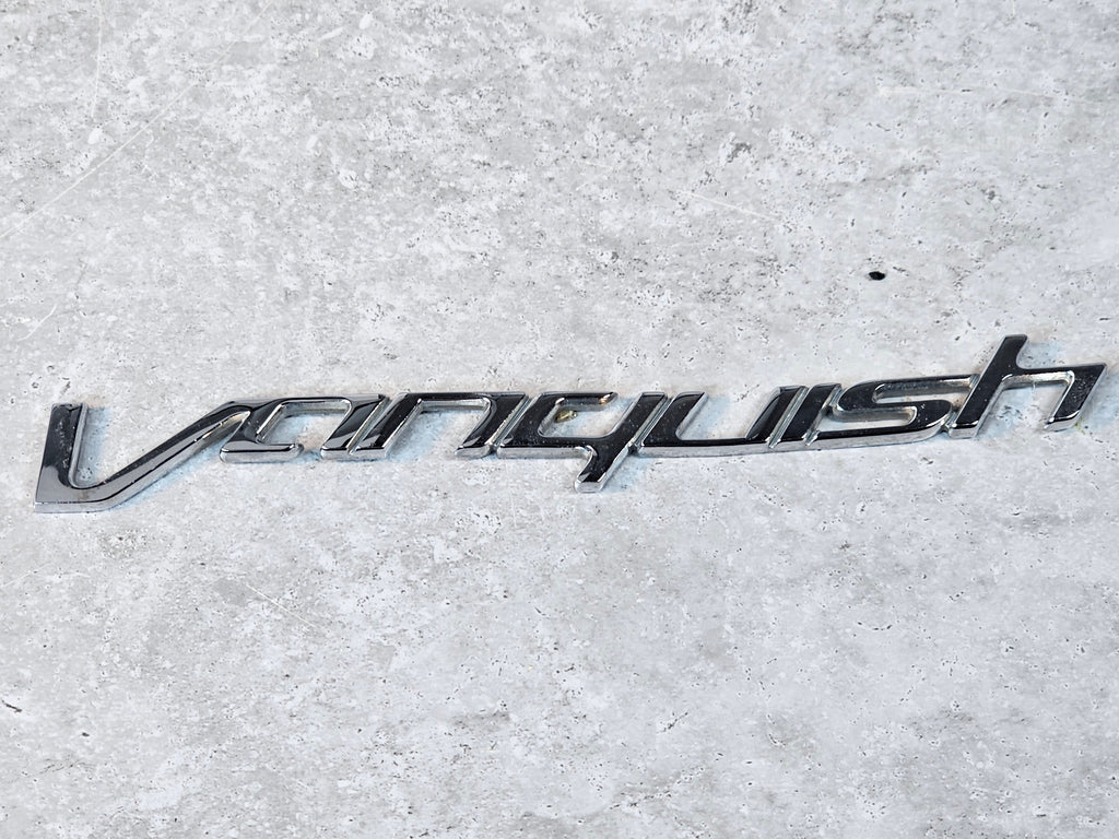 ASTON MARTIN VANQUISH DECKLID BADGE CD33-001B40-CA
